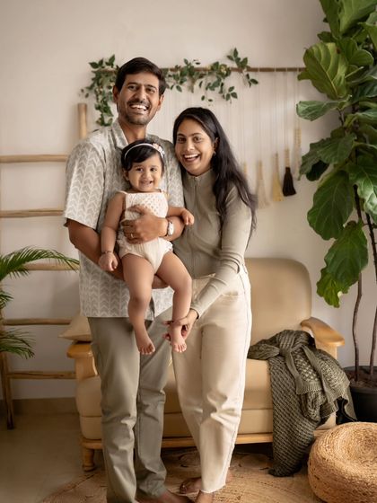 A happy family of three, enjoying a moment in our cozy studio.