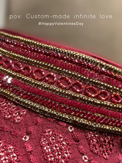 A close-up of the 'Infinite Love' bandi collar. The infinity symbol was a design concept from the father of the bride to portray the infinite love shared within their family.