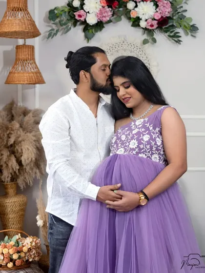 A sweet kiss on the forehead, a timeless gesture of love and affection, perfectly captured in the cozy boho studio.