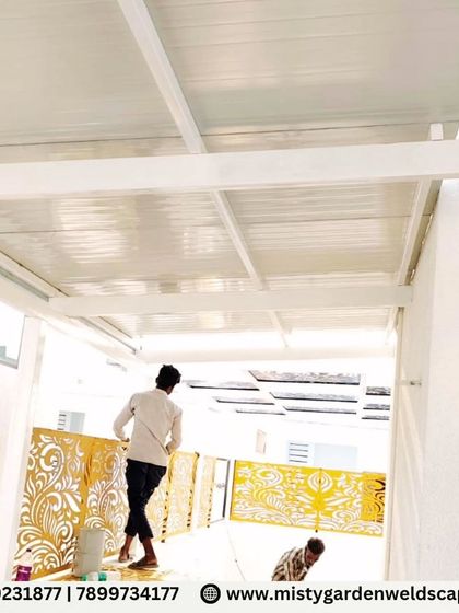 A luxury outdoor pergola at Natura Atavi, featuring a durable puff sheet roof for complete sun and rain protection. The design is enhanced with CNC designer panels, adding a bold architectural statement to this functional and stylish living space.