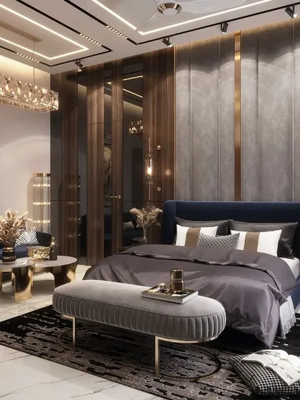 A master bedroom should be a personal sanctuary. In this Rohtak residence, I combined rich wood tones, plush fabrics, and sophisticated gold accents to create a space that is both opulent and deeply comfortable, complete with a dedicated seating area for quiet moments.