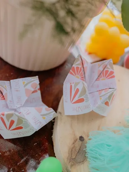 We even personalized the paper fortune tellers with the event's hashtag, creating a fun, nostalgic, and interactive element for guests to enjoy.