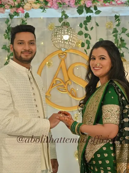 A bright and happy engagement ceremony. The groom looks effortlessly sharp in his white bandhgala, with subtle grooming to enhance his features for the camera.
