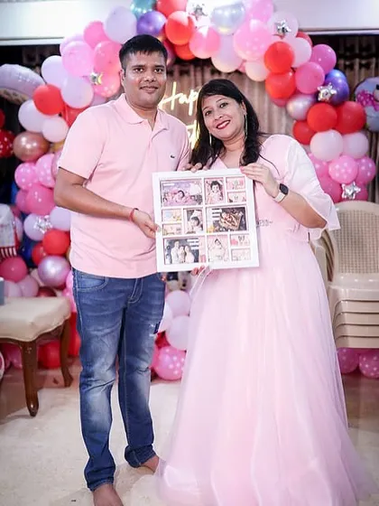 The proud parents holding the frame that tells their daughter's story. These are the moments that make my work so fulfilling.