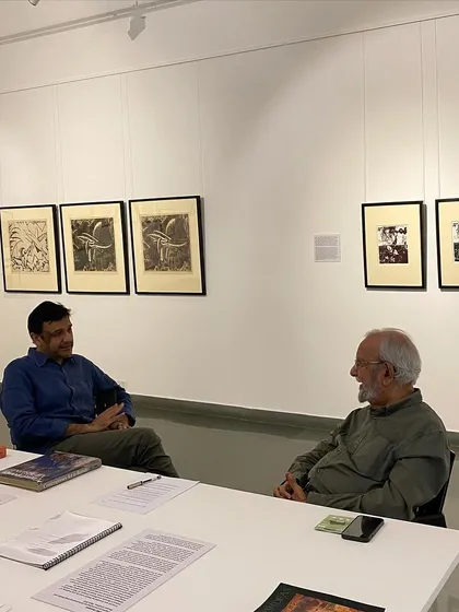 Collector Abhishek Poddar in conversation with Gulammohammed Sheikh at the exhibition.