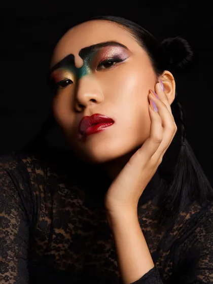 Another angle of this creative masterpiece, showing the glossy, artistic lip and the intricate blending of colors on the eyes.