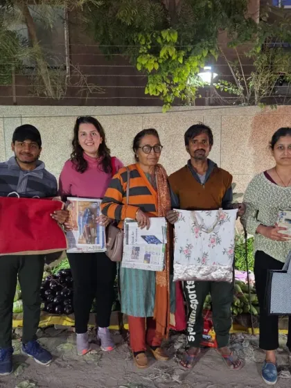 Our volunteers are the heart of our movement. Here, you can see our team at a local market, distributing reusable bags and talking to vendors about reducing single use plastic. It's these small, consistent actions that create big waves of change.