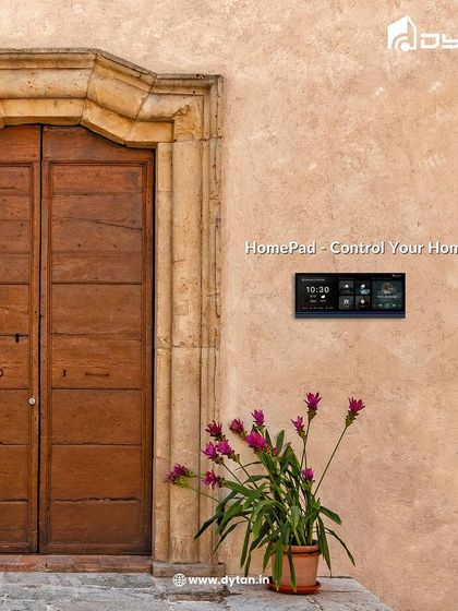 The HomePad blends beautifully with rustic and traditional architecture. Here it is installed by an old wooden door, showing its versatility across different design styles.
