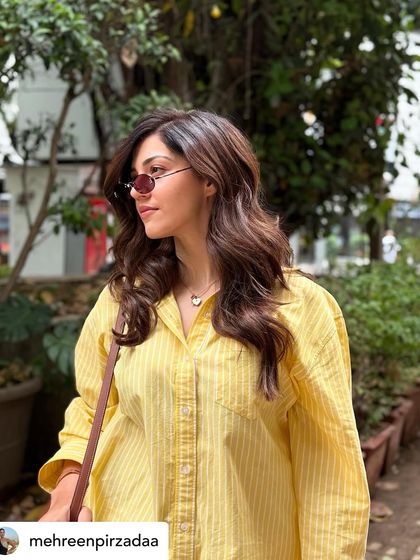 A candid of Mehreen Pirzada showing off the beautiful dimension and soft waves of her new hair colour.