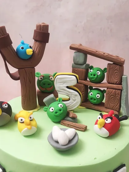 A close-up of the action on our Angry Birds cake, showing the detailed fondant figures and the nest of eggs.