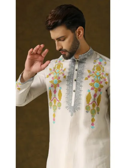 A detailed shot of the Narayan Nirvana kurta, focusing on the vibrant threadwork that makes this piece a true work of art.