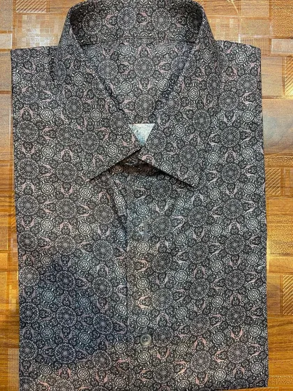 A custom-made formal shirt featuring a unique geometric print on 100% pure cotton fabric. I can help you find a print that expresses your personal style while maintaining a professional look.