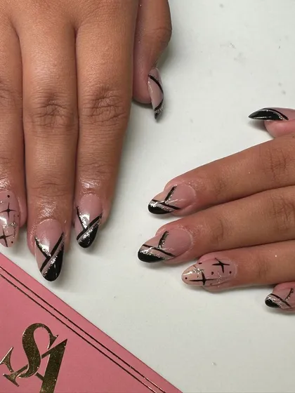 An edgy and graphic design with a sheer nude base, featuring sharp black lines and silver glitter accents for a modern look.