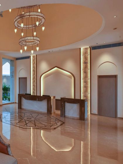 The reception area at The Fern Sattva Resort features a custom-designed floor inlay and locally inspired architectural details. The goal was to create a welcoming space that immediately introduces guests to the resort's unique blend of modern luxury and regional charm.