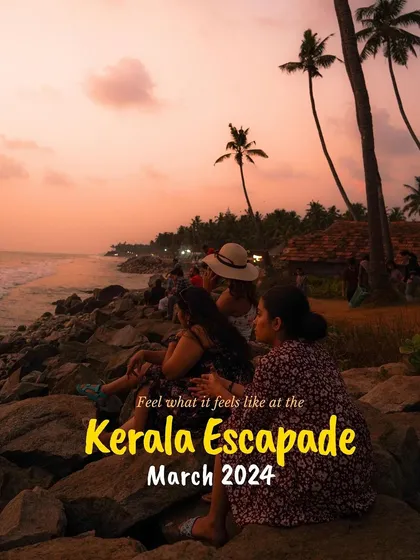 "Feel what it feels like at the Kerala Escapade." A group of women sit on the rocks at Varkala cliff, watching a stunning sunset. This image captures the soul of our Kerala trips.