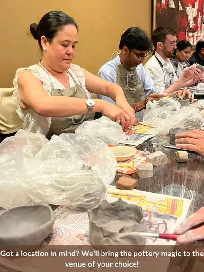 Your place or ours? We can bring the entire pottery experience to you. This image shows one of our offsite workshops, fully equipped with all the tools and materials needed for your group to get creative at a venue of your choice.