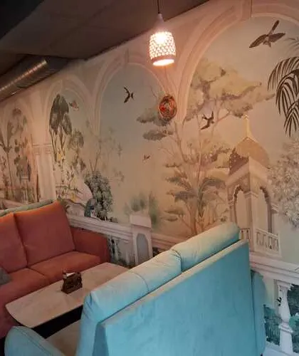 I designed and installed this serene, scenic mural for a local cafe in Bengaluru, creating an elegant and inviting atmosphere. The arched panels give the illusion of windows looking out onto a tranquil landscape, enhancing the customer experience.