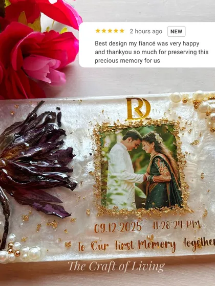 This beautiful resin plate was created to preserve a single lotus gifted by a fiancé, a symbol of a new beginning. I incorporated the couple's photo, initials, and the date of their first memory together. The five-star review from the happy client shows just how much these personal touches mean.
