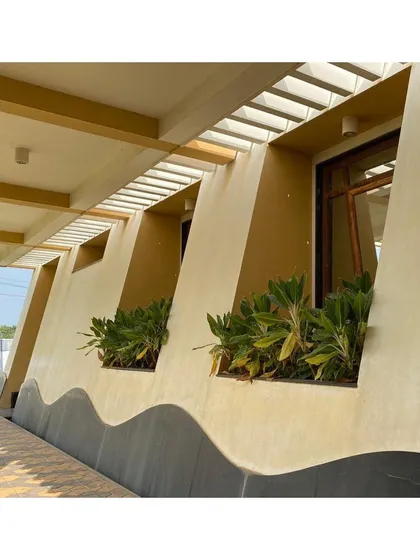 This detail from our CC Office project shows how we integrate landscape directly into the building's facade. The deep, recessed sills become planters, a technique we use to create site-sensitive resort architecture that feels connected to nature.