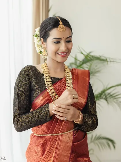An identical shot to the previous one, capturing a moment of pure joy and elegance, perfect for showcasing a complete traditional look.