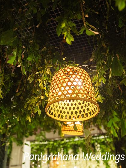 A detail of a hanging bamboo lamp, part of a green ceiling installation. This shows our love for using natural and sustainable materials in our designs.
