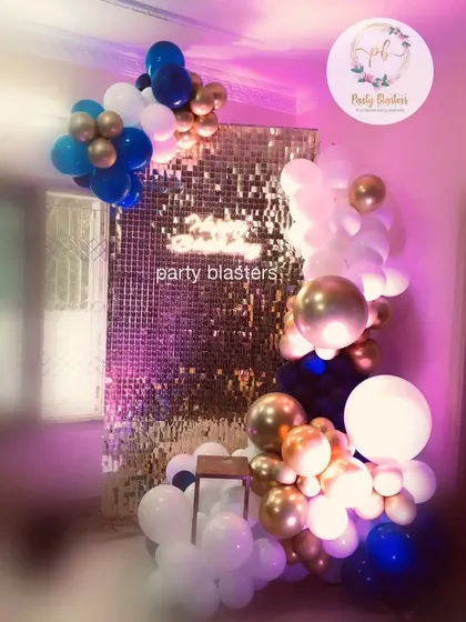 We build modern and stylish photo opportunities like this shimmering gold sequin wall. Paired with a custom organic balloon garland in the company's brand colors of blue, white, and gold, it creates a perfect, Instagram-worthy spot for any corporate party.