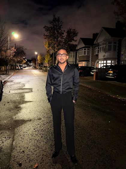 Our client Mr. Basrah looking fabulous in a customized satin zip-up shirt and tailored trousers during a night out in the UK.