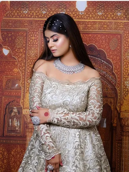 See how my collection goes beyond the wedding day. This gorgeous off-shoulder gown paired with a sparkling diamond necklace is perfect for your reception, cocktail party, or engagement. It’s all about modern glamour.