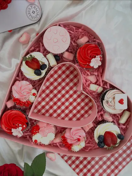 Sweeten your Valentine’s Day with our heart-shaped cupcake box. It's filled with a variety of our most popular cupcakes, decorated with love.