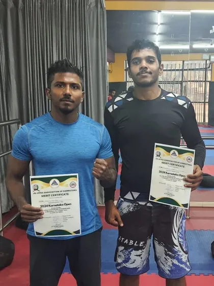 Posing with my coaches and fellow competitors after the Karnataka Open 2024. The support from your team is just as important as the work you do on the mats.