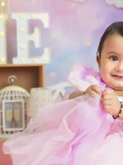 A beautiful, happy smile from the birthday girl in her pink princess dress. We make sure to capture these joyful expressions.