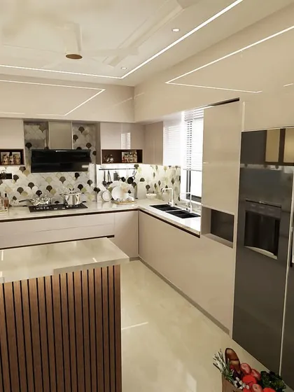 Another angle of the kitchen design, showing the L-shaped layout and the integration of the refrigerator and oven. We plan every detail to ensure a perfect fit and finish.