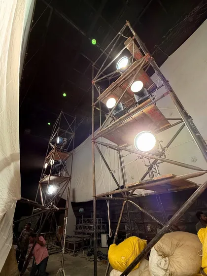 The lighting setup for the Big Boss promo seen from the side. This view shows how we use large diffusion frames in front of powerful lights to create a soft, wrapping light source.