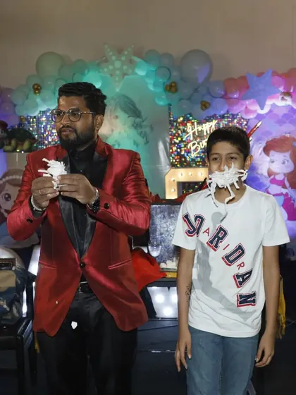 The aftermath of a very funny illusion. This young volunteer was a fantastic assistant, and his reaction was a highlight of the birthday party show.