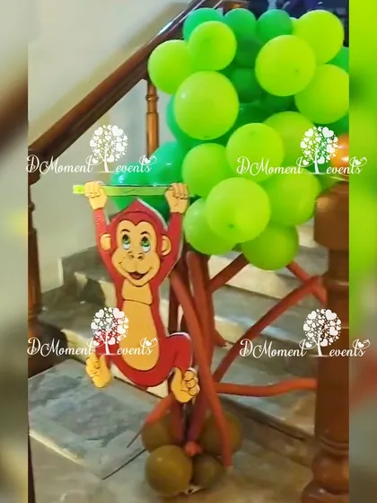A fun detail from the Lion King party: a monkey cutout climbing a balloon tree on the staircase.