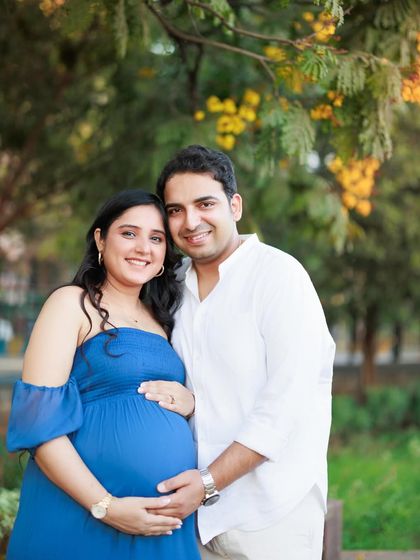 A lovely portrait of an expecting couple during their outdoor session. They both have such warm smiles, radiating happiness and excitement for their baby on the way.