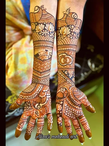 An engagement design with peacocks, rings, and other traditional motifs. It's a beautiful way to celebrate the beginning of a new journey.