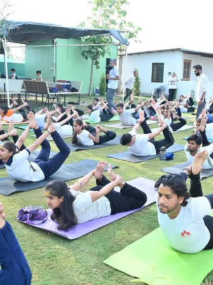 An outdoor yoga session for International Day of Yoga. Practicing together in nature, we celebrate the unity and peace that yoga brings.