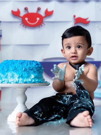 Here is the fun part of a nautical cakesmash. I encourage babies to get messy and have fun, which is how I capture those priceless expressions of discovery and delight.