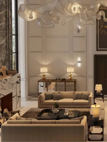 This expansive living room exemplifies modern design with a touch of grandeur. Soaring ceilings and a neutral palette create a feeling of openness, while luxurious details are evident throughout.