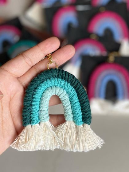 A rainbow keychain in cool shades of green and blue.