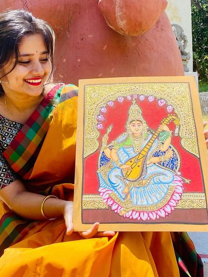 A close-up of my completed Mysore-style painting of the goddess Saraswati. This traditional art form is known for its delicate lines, intricate details, and the use of real gold foil.