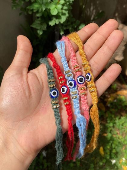 The perfect evil eye rakhi to celebrate the bond of love, support, and sibling rivalry. Each one is handmade and comes in vibrant colors.