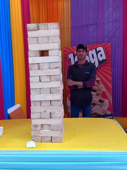 The giant Jenga game is always a hit. Guests love the suspense of carefully pulling out blocks from the massive tower, making it a great interactive stall for any party.