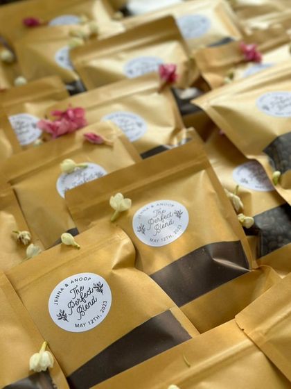 Personalized wedding favors: packets of 'The Perfect Blend' of local Coorg coffee for guests to take home.