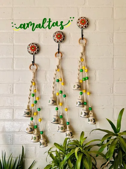 A beautiful display of our 'Symphony Chimes' in the 'Amaltas' color combination. The yellow and green beads paired with hand-painted ceramic bells create a fresh and natural look.