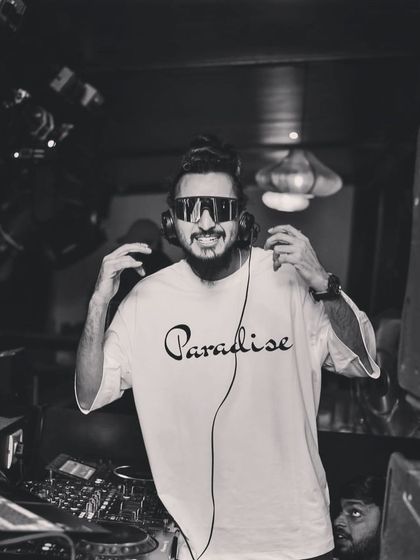 A black and white portrait, holding my headphones. This shot has a classic, cool vibe.