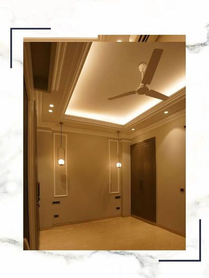 This bedroom is designed with subtle elegance, featuring minimalist pendant lights, clean wall paneling, and a dark wood wardrobe that adds a touch of contrast and sophistication.