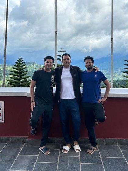 A moment of rest and reflection at the Namo Buddha Monastery, with the vast Himalayan landscape in the background.