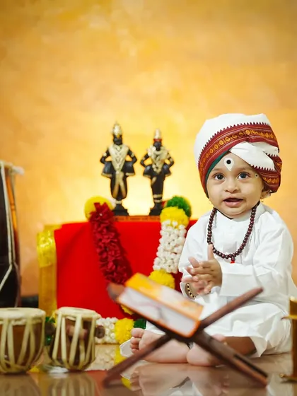 Ramkrishna Hari. A little boy dressed as a Varkari pilgrim claps his hands, ready to sing his praises to Lord Vitthal.